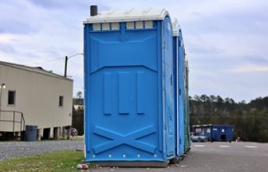 porta potties in a row and a construction yard